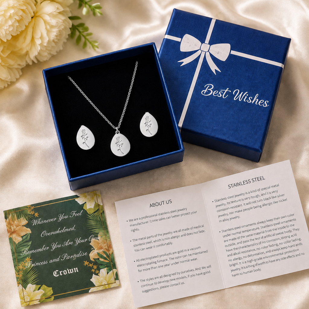 Silver rose engraved oval necklace and earring set in navy blue "Best Wishes" gift box — stainless steel jewelry with greeting card and care booklet, perfect gift for women