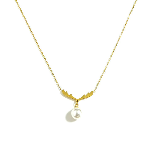 Gold antler pearl pendant necklace close-up on white background — antler charm with dangling white pearl, fine gold chain