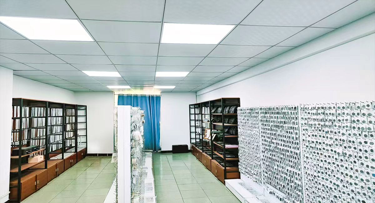 Dorriss Jewelry showroom interior with shelves displaying stainless steel jewelry collections — rings, necklaces, and bracelets organized in a professional warehouse showroom