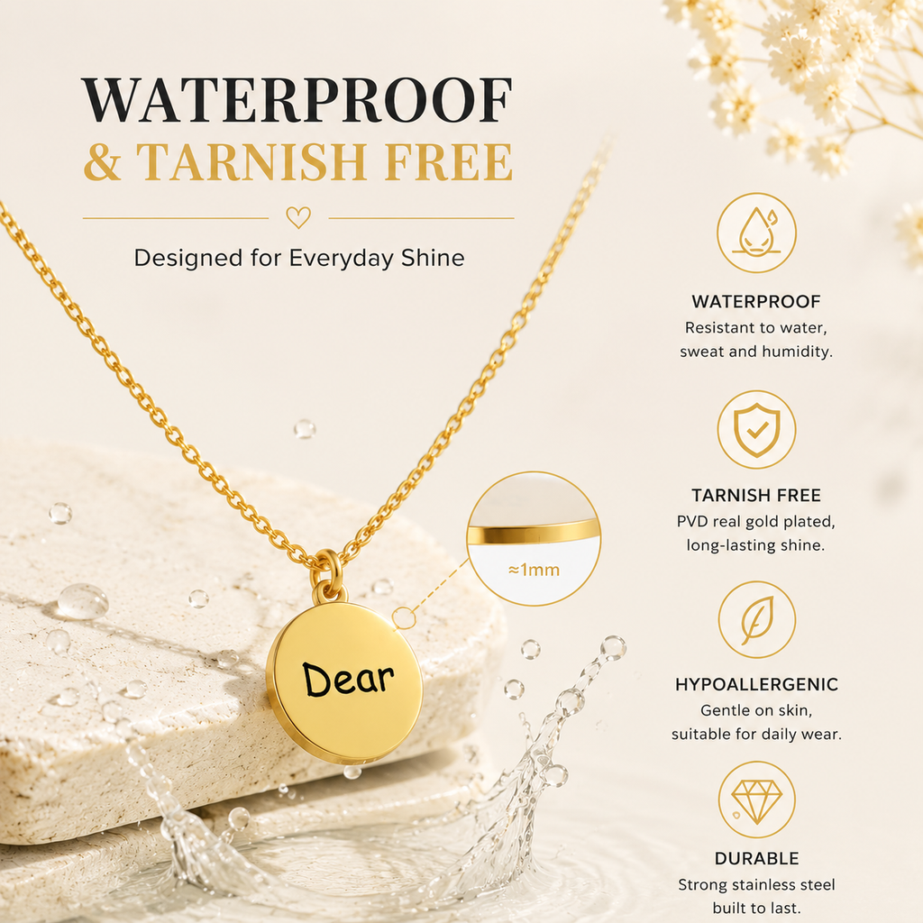 Waterproof gold PVD plated necklace with Dear engraved coin pendant surrounded by water splash, tarnish-free.