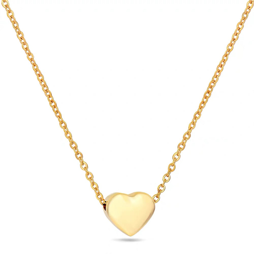 Dainty 18K gold puffed heart pendant necklace on cable chain, stainless steel, white background