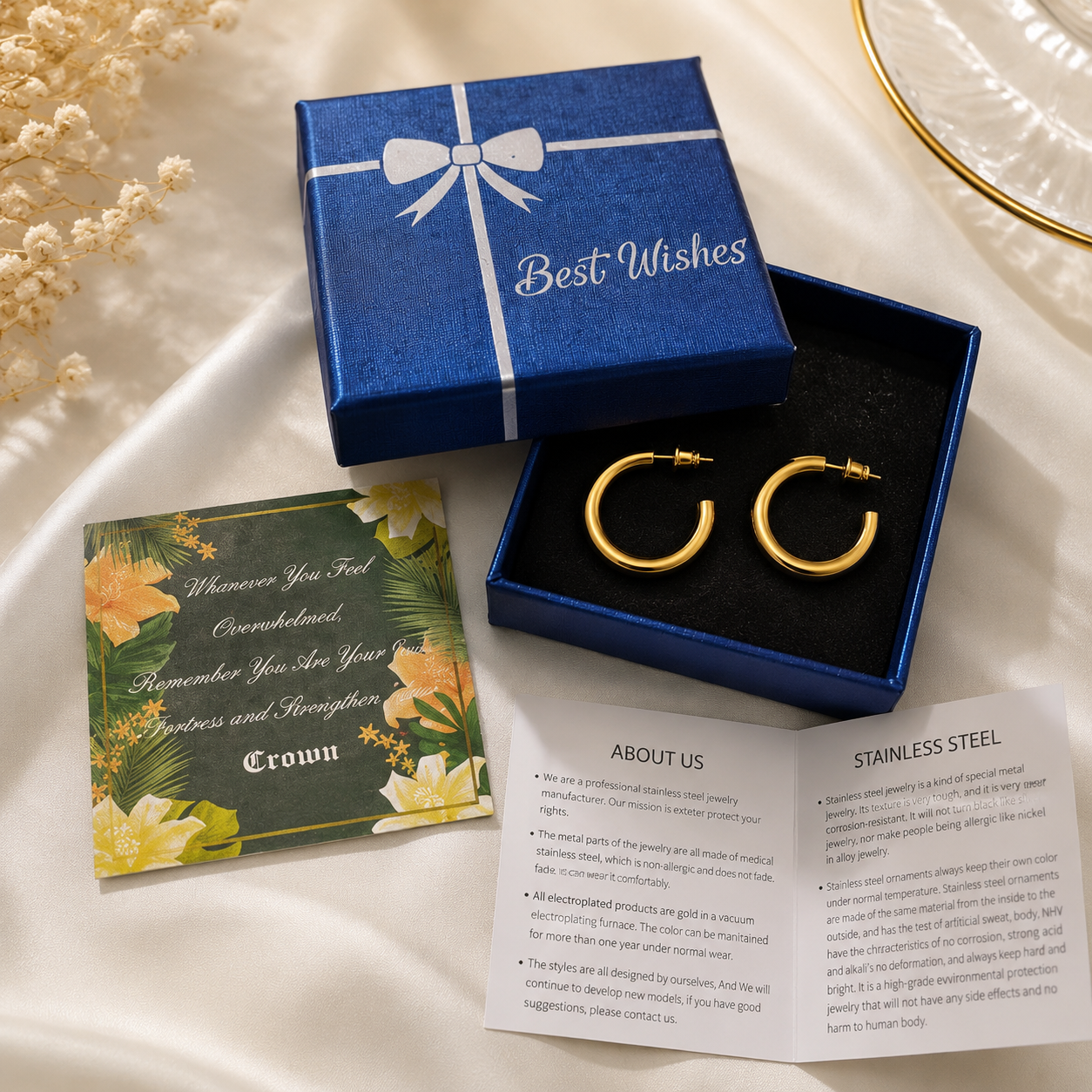 Gold hoop earrings in blue Best Wishes gift box with greeting card and stainless steel care card