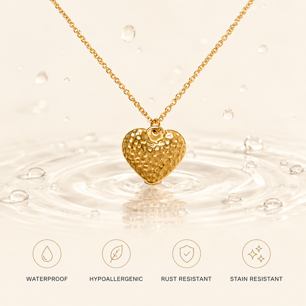 Waterproof gold heart necklace featuring a hammered pendant touching water ripples, rust-resistant and hypoallergenic.