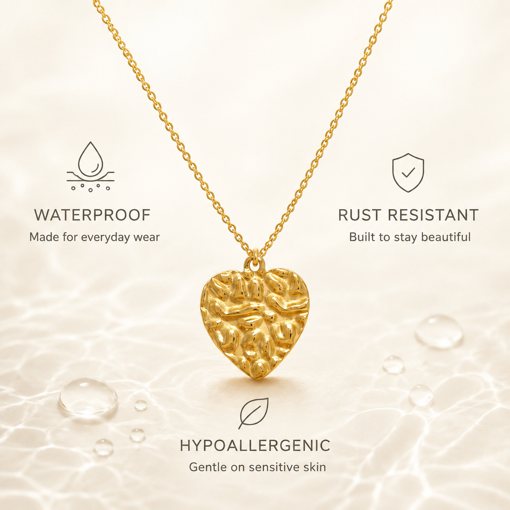 Waterproof stainless steel necklace with textured gold heart pendant over water, rust-resistant and hypoallergenic.